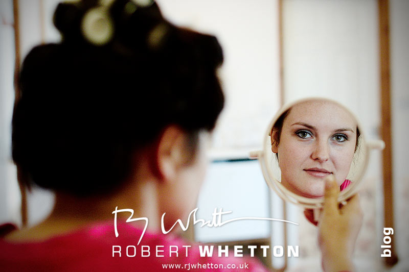 Wedding of Jo and Ben Christie at Kingston Country Courtyard, Swanage Jo looking in mirror - Dorset Wedding Photographer Robert Whetton
