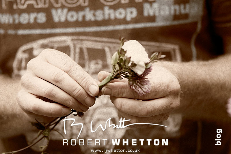 Wedding of Leah and Neil at St Marys, West Moors Neil making button holes - Dorset Wedding Photographer Robert Whetton