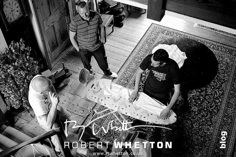 Wedding of Jo and Ben Christie at Kingston Country Courtyard, Swanage Ben doing the ironing with the lads - Dorset Wedding Photographer Robert Whetton