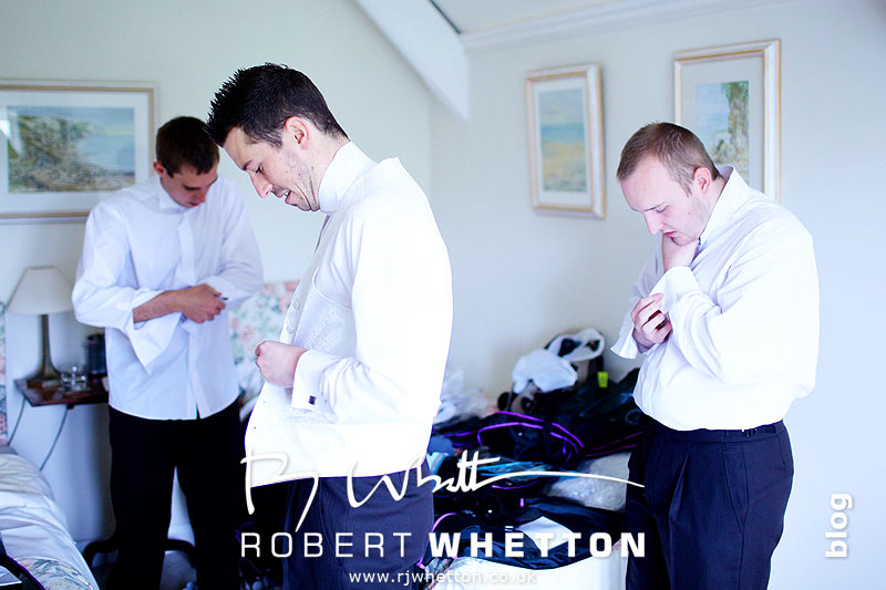 Wedding of Jo and Ben Christie at Kingston Country Courtyard, Swanage Ben and the lads getting dressed - Dorset Wedding Photographer Robert Whetton