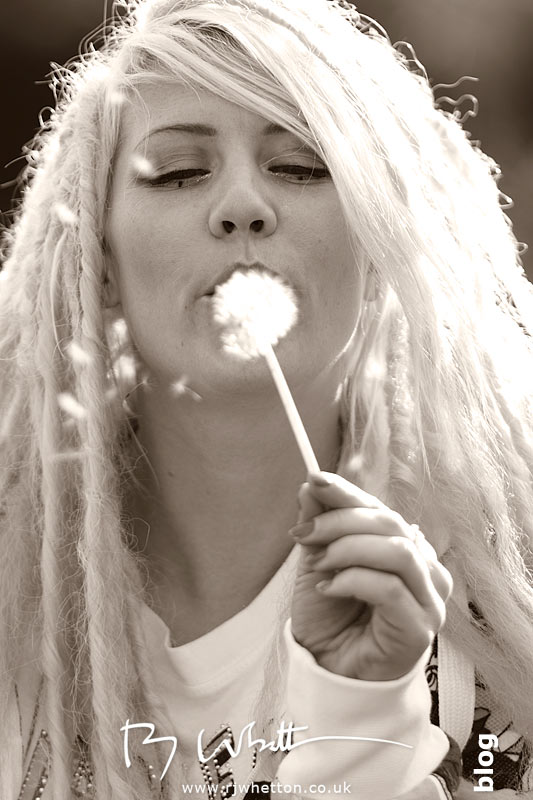 Candid moment on the way back to the car Pixie blowing dandy lion on the way back to the car - Professional Portraits Dorset