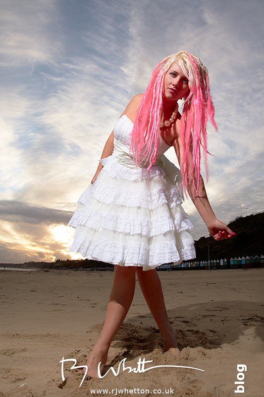 Posing on the beach against the setting sun Pixie poses on the beach against the settnig sun - Professional Portraits Dorset