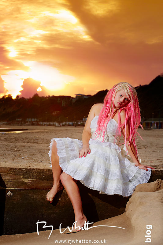Posing down on the sea front against the setting sun Pixie poses on the sea front against the settnig sun - Professional Portraits Dorset