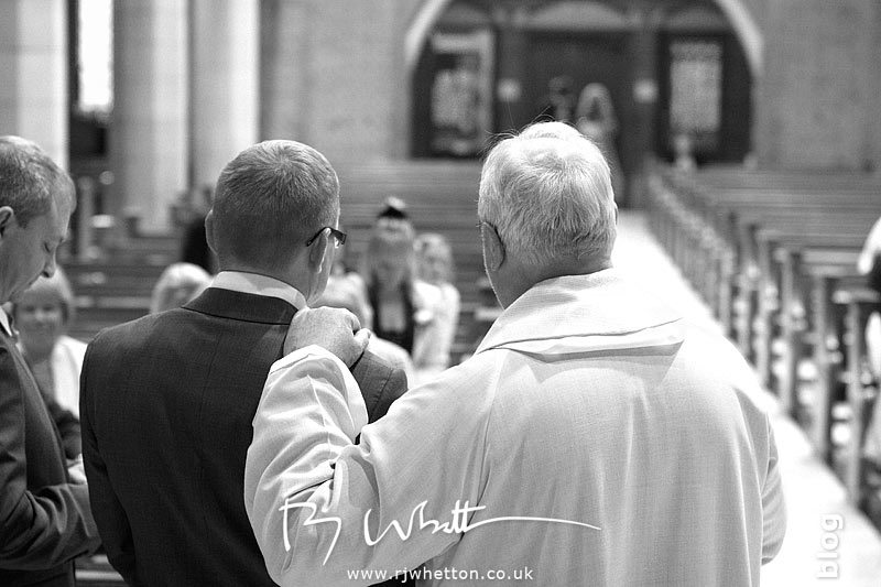 Father Denis reassuring Darren Father Denis reassuring Darren - Professional Wedding Photography Dorset