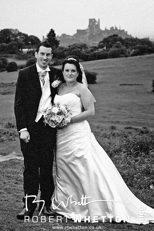 Wedding of Jo and Ben Christie at Kingston Country Courtyard, Swanage Jo and Ben on a hill overlooking Corfe Castle - Dorset Wedding Photographer Robert Whetton