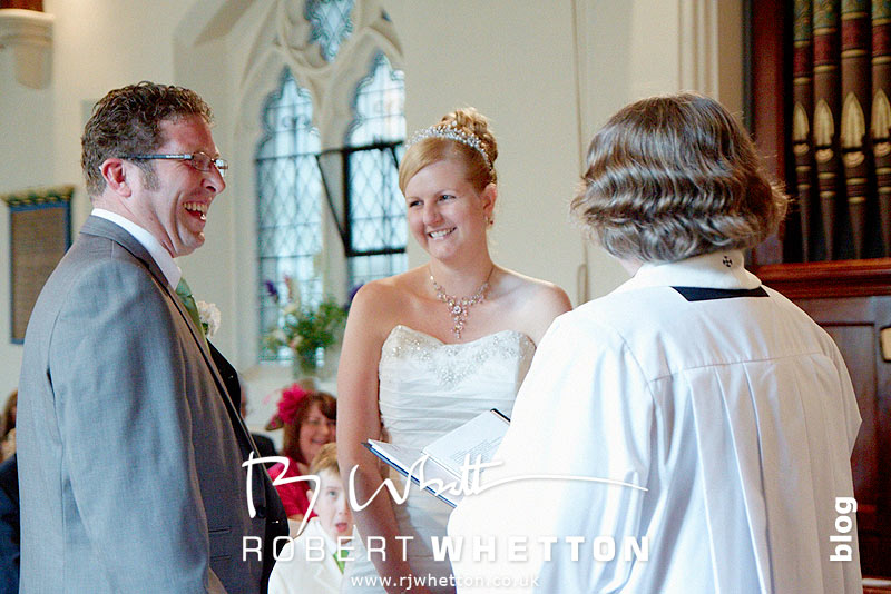 Wedding of Leah and Neil at St Marys, West Moors Laughter - Dorset Wedding Photographer Robert Whetton