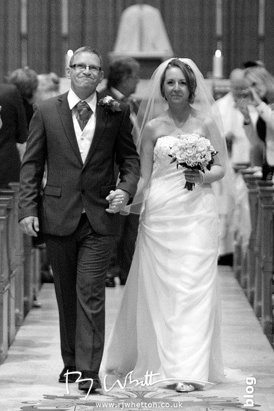 Happy couple exit the church Happy couple exit the church - Professional Wedding Photography Dorset