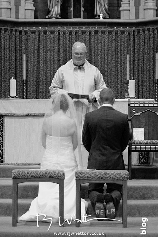 Father Denis blessing the couple Father Denis blessing the couple - Professional Wedding Photography Dorset