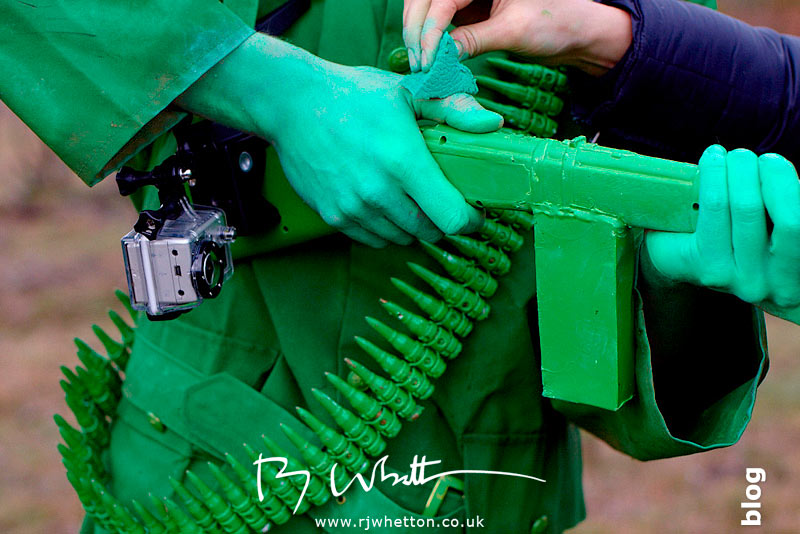 GoPro strapped to gun butt. Make-up applied to hands GoPro strapped to gun butt. Make-up applied to hands - Production Photography Dorset