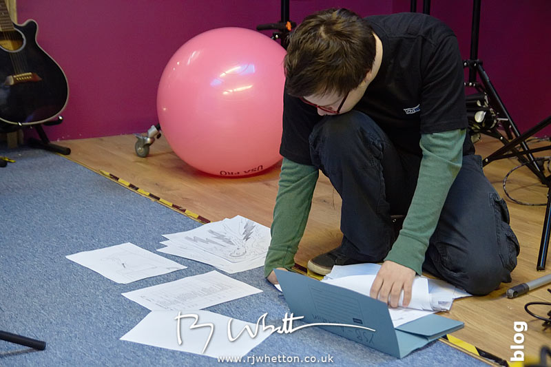 Sunny Clarke sorts out the storyboard filming order Yes Sir Boss - Not Guilty Production Still - Production Photography Dorset