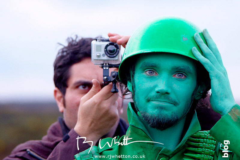 Film crew attaches GoPro to actors helmet Film crew attaches GoPro to actors helmet - Production Photography Dorset