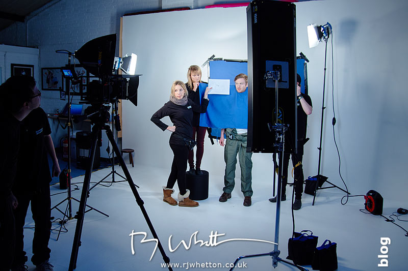 The story board for each scene is held up beside the performers so they can see what is needed for each take Yes Sir Boss - Not Guilty Production Still - Production Photography Dorset