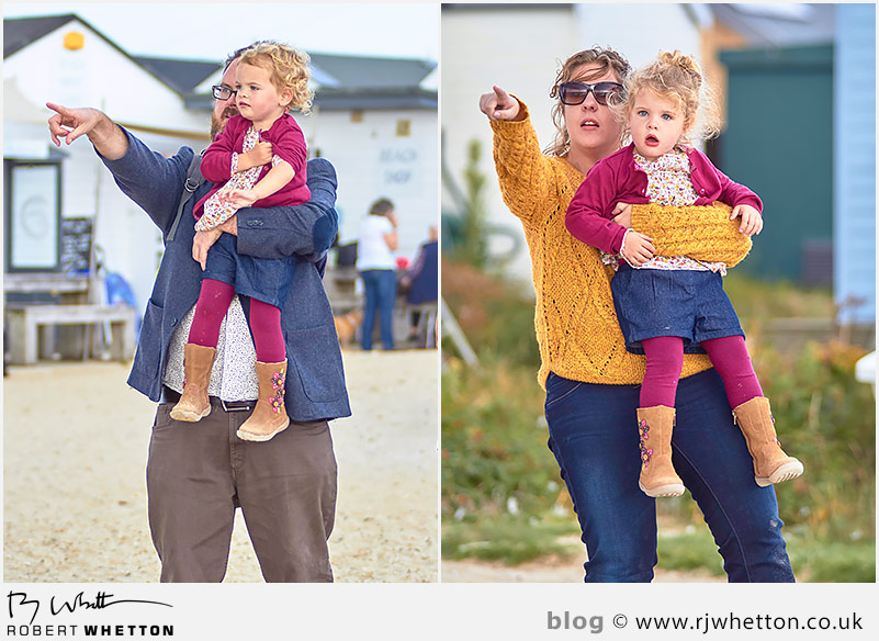 Mum and dad holding girls pointing out to sea Mum and dad holding girls pointing out to sea - Portrait Photography Dorset