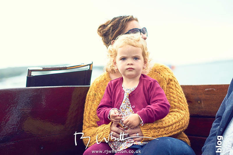 Harper sitting on mums lap in the boat Harper sitting on mums lap in the boat - Portrait Photography Dorset