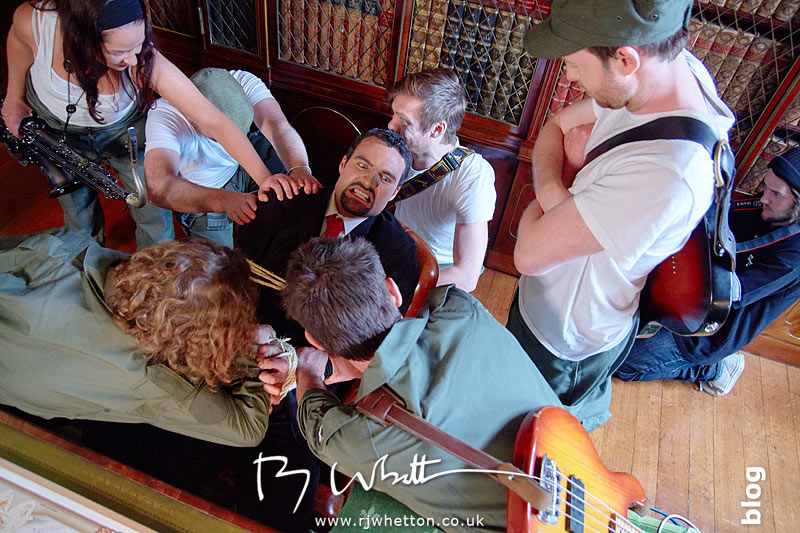 The villain fights the Yes Sir Boss team as they tie him up Yes Sir Boss - Not Guilty Production Still - Production Photography Dorset